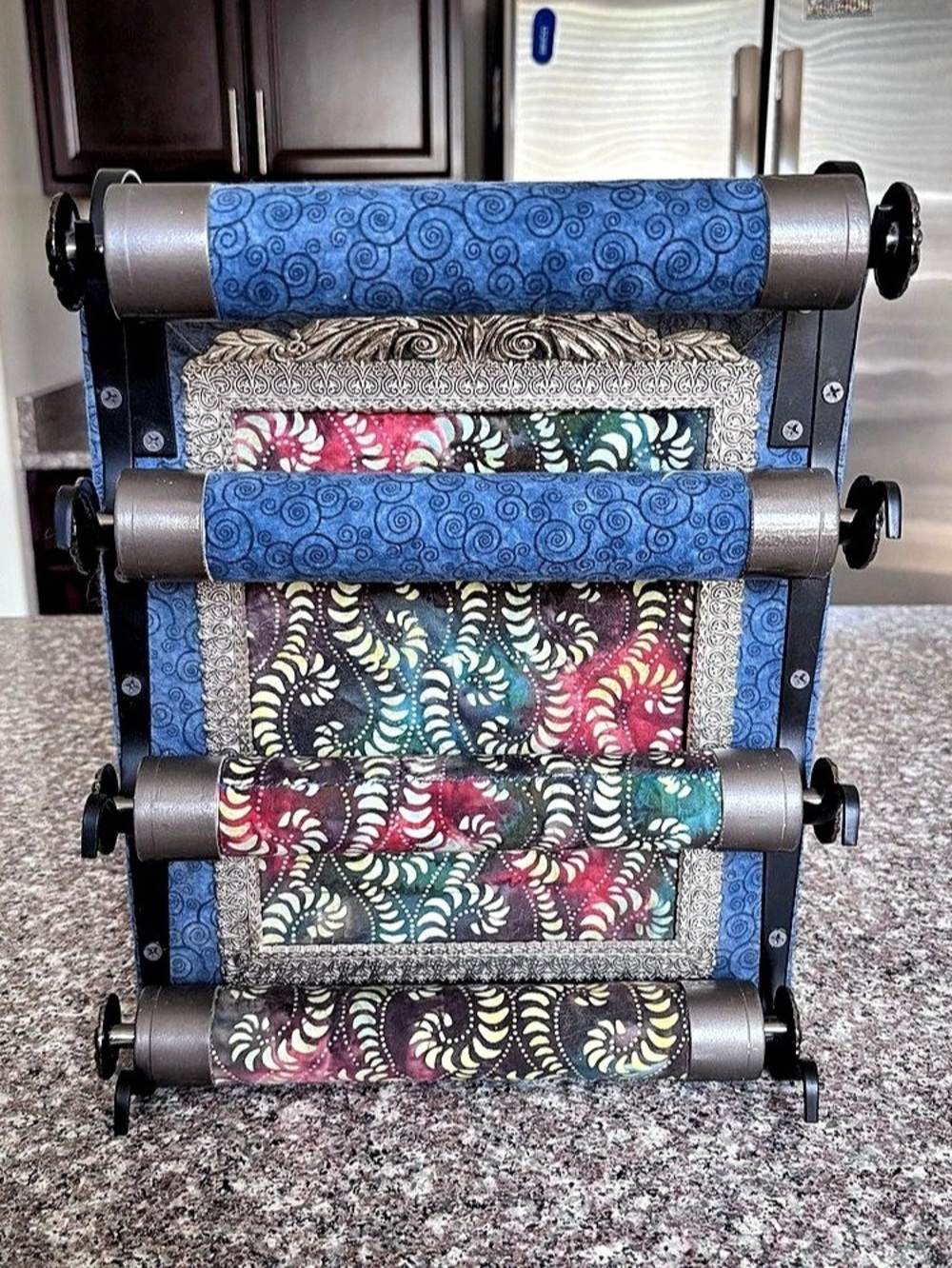 Decorative Multi-Tier Fabric Roller Stand – Ornate Framed Batik Panel